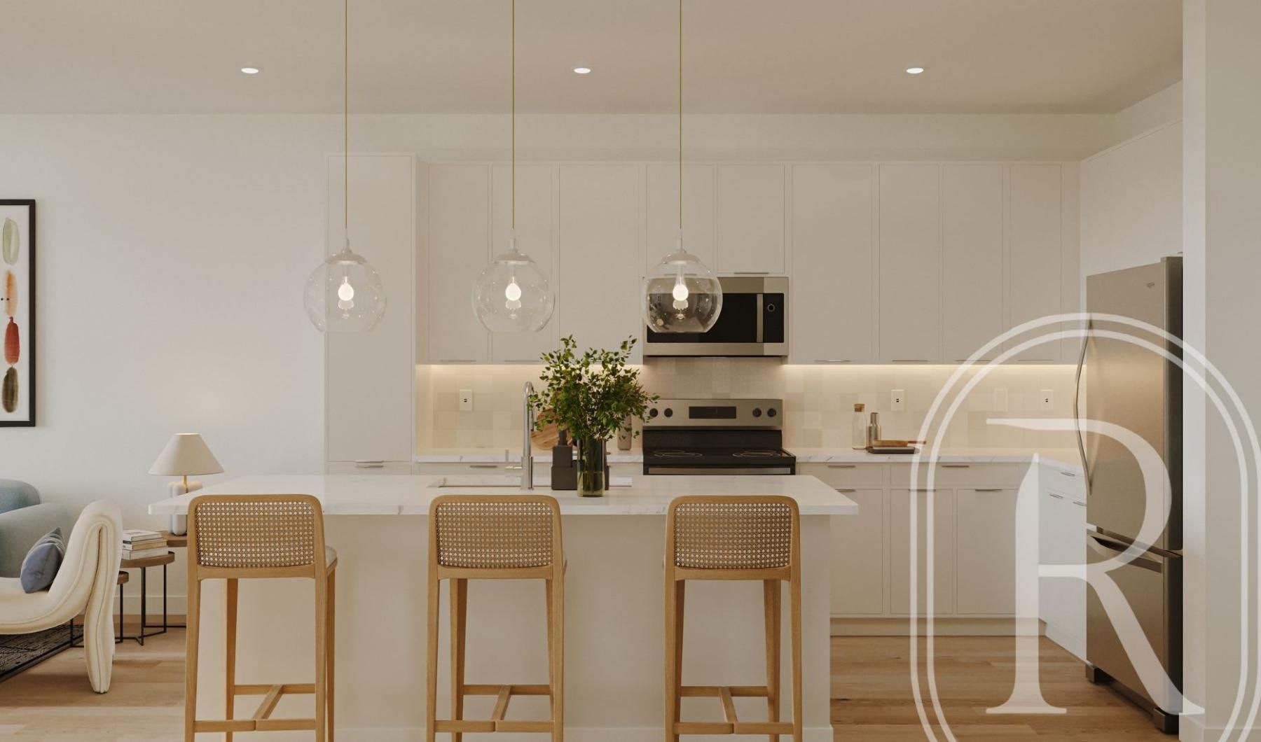 a kitchen with white cabinets